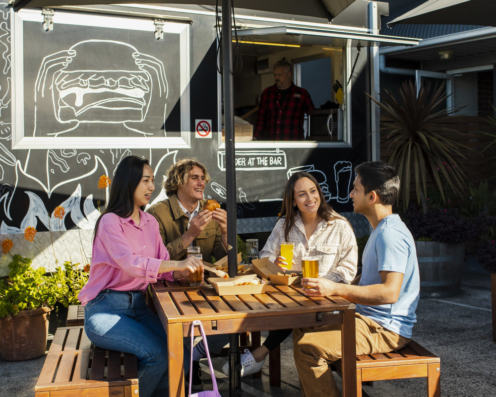 People sitting outside Wollongong cafe 