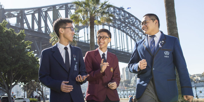 Trio of students outside Sydney Harbour Bridge