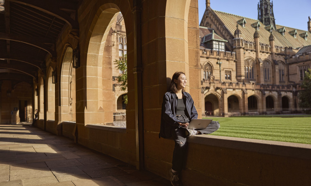 Woman at Sydney University looking onto quadrangle
