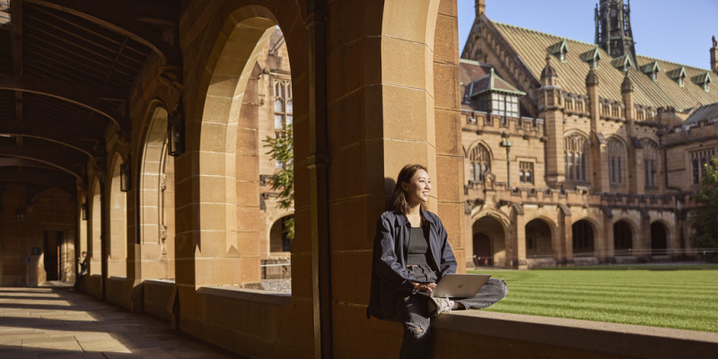 Woman at Sydney University looking onto quadrangle