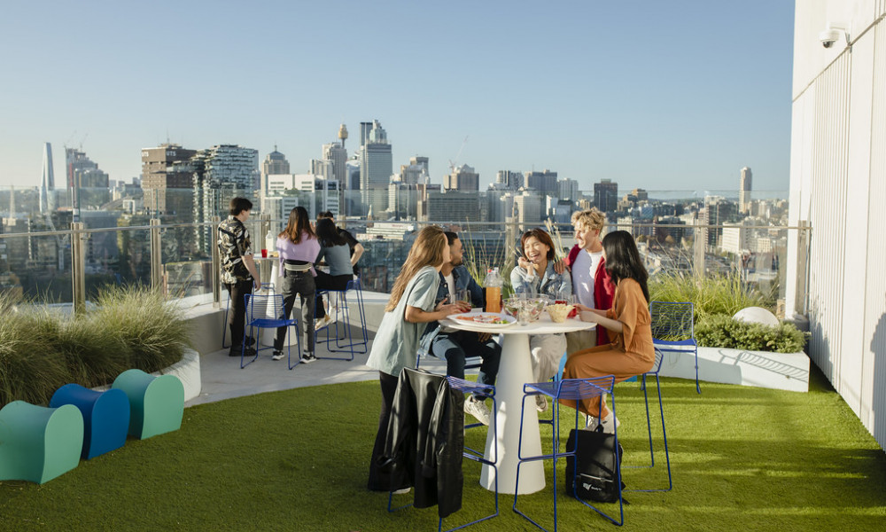 People enjoying a meal looking at the city